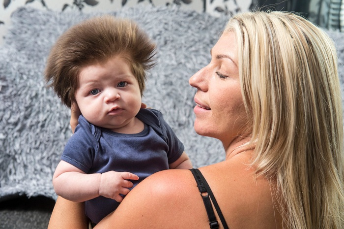 Nine-week-old baby has better hair than you